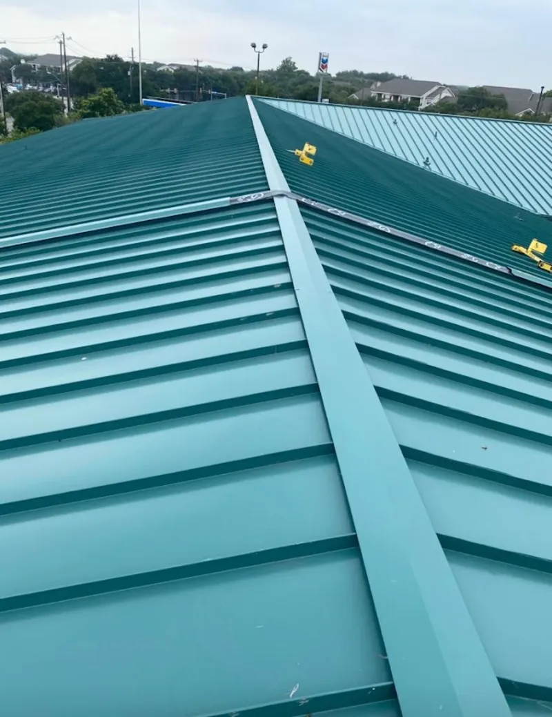 Green commercial metal roof ridge and valley for Metal Roof Repair in Chardon