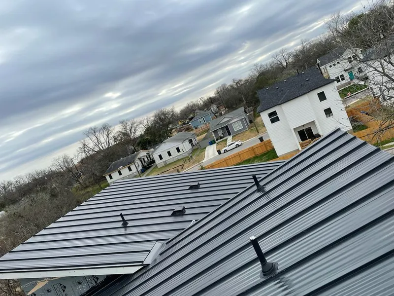 Standing seam metal roof panels with vents for Skylight Repair in Chardon